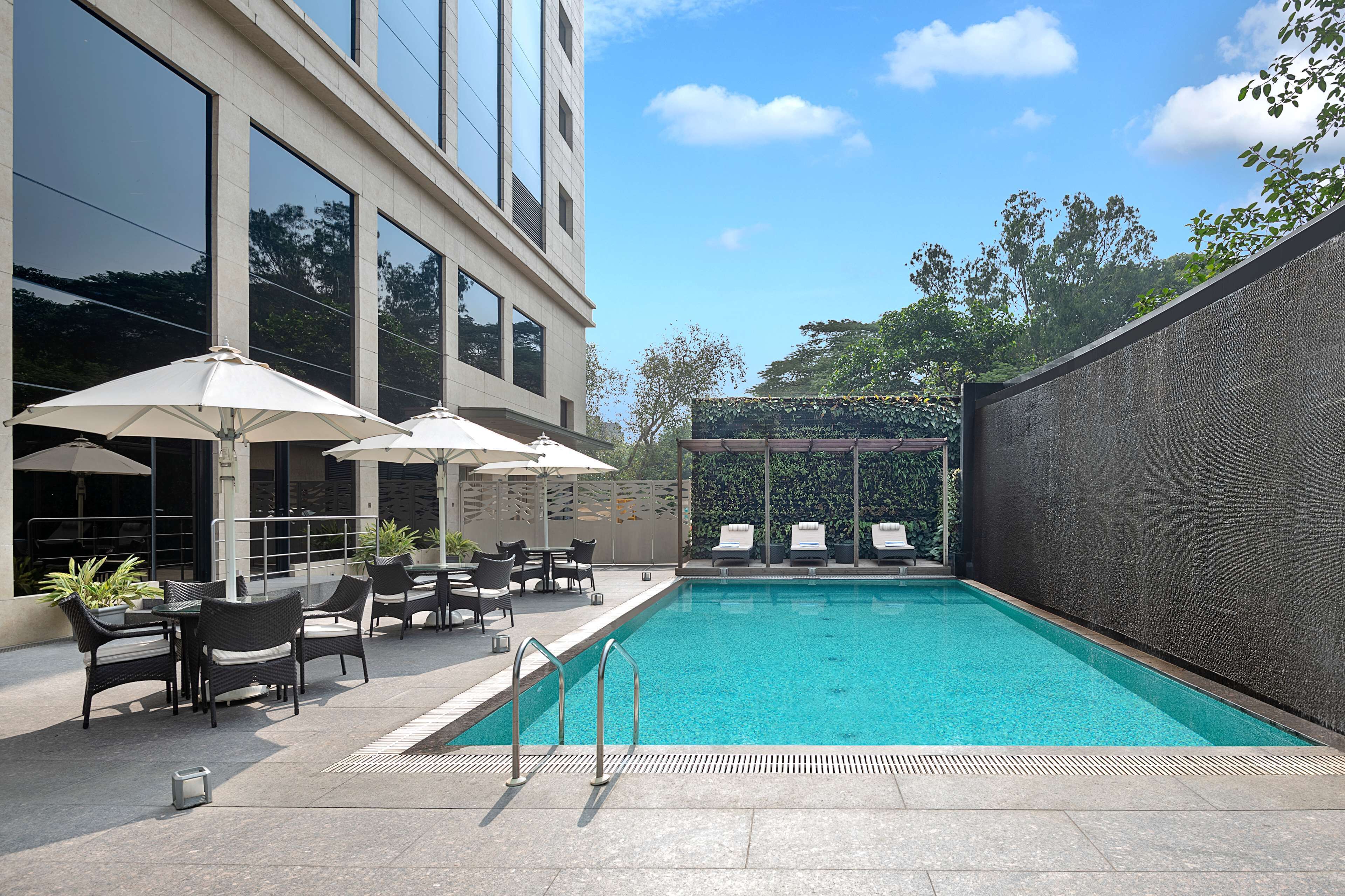 outdoor pool, open 7:00 am to 8:00 pm, pool loungers