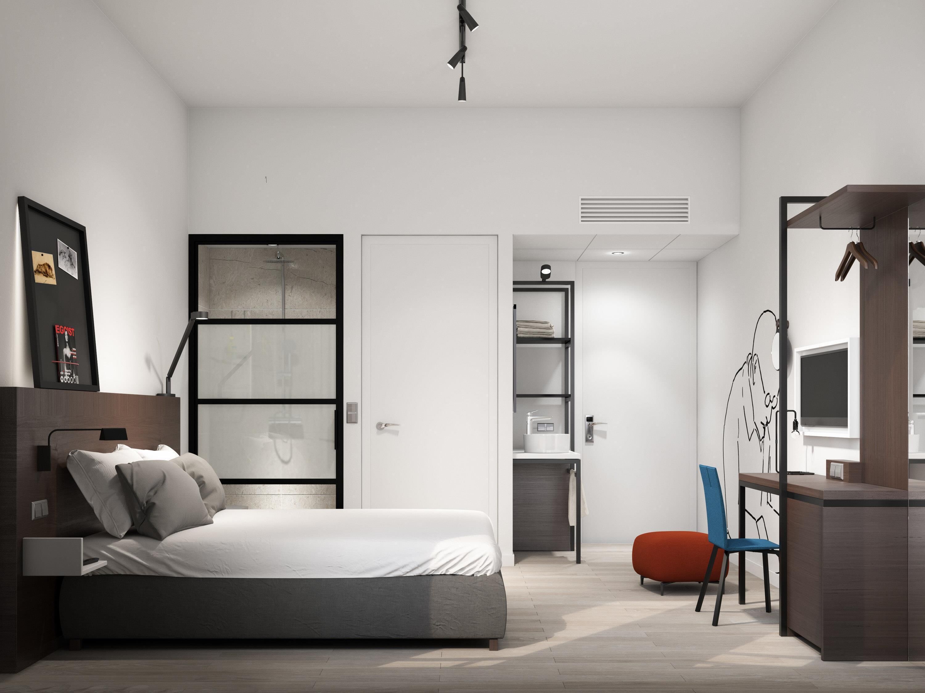 Ropa de cama hipoalergénica y caja de seguridad en la habitación 