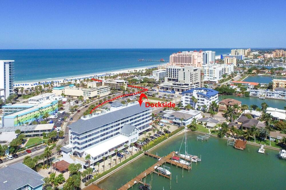 With 3 bedrooms and 2 bathrooms, this condo is perfect for families and is even PET FRIENDLY! Watch the sun rise over the marina and the dolphins at play in the channel from the waterfront balcony! This condo is centrally located within easy walking distance of the beach, Pier 60 and local shops and restaurants. <br><br>KITCHEN <br>-Stove/Oven <br>-Refrigerator <br>-Dishwasher <br>-Microwave Oven <br>-Toaster <br>-Blender <br>-Coffee Maker <br>-Dishes/Utensils <br>-Cookware <br>-Granite Countertops <br>-Stainless Steel Appliances <br><br>DINING AREA <br>-Large Table with Seating for 6 <br>-Breakfast Bar with Seating for 3 <br><br>LIVING ROOM <br>-Leather Sofa <br>-Arm Chairs<br>-Flat Screen SMART TV with Cable<br><br>MASTER BEDROOM <br>-King Size Bed <br>-Flat Screen Cable TV <br><br>2ND BEDROOM <br>-King Size Bed <br>-Flat Screen Cable TV <br><br>3RD BEDROOM <br>-Two Twin Size Beds <br>-Flat Screen Cable TV <br><br>TWO BATHROOMS <br>-One Bathroom with Shower/Tub Combo <br>-2nd Bathroom with Walk-in Shower <br><br>FREE PARKING <br>-2 Unassigned Spaces <br>-2 Hang Tags Provided in Unit upon Check-in <br>-Trailers, U-Hauls, Boats, and RV\'s are NOT allowed to be parked on the property!<br><br>OTHER AMENITIES <br>-FREE Wi-Fi & Cable TV <br>-One Pet Allowed Up to 35 lbs. (requires pre-approval by management) <br>-Stackable Washer and Dryer in Unit <br>-Beach Chairs, Umbrella and Beach Toys Available for Guests\' Use <br>-Communal Waterfront Heated Pool <br>-Community Clubhouse <br>-Community Picnic Area <br>-Community Gas Grill <br>-Fishing Dock Available for Guests\' Use <br>-Marina Views from Front Door Balcony <br>-Beach Access 1 Block Away<br><br>CHECK-IN <br>-Keyless Entry <br>-Self Check-In <br>-Secure Coded Entrance to Building <br><br>POINTS OF INTEREST <br>-Clearwater Aquarium (1.6 miles) <br>-Pier 60 (0.8 miles) <br>-John’s Pass (13 miles) <br>-St. Pete/Clearwater International Airport (PIE) (12.7 miles) <br>-Tampa International Airport (TPA) (21 miles) <br>-Busch Gardens, Adventure Island (33 miles) <br>-Florida Aquarium (26.8 miles) <br>-Tropicana Field (Home of the Tampa Bay Rays) (23.5 miles) <br>-Raymond James Stadium (Home of the Tampa Bay Buccaneers) (22.4 miles) <br><br>SORRY, NO SMOKING! THANK YOU! <br><br>You can do as much or as little as you like at Clearwater Beach, a bustling beach town that offers spectacular white sand beaches, a wide variety of water sports, and several local restaurants and boutiques. It\'s a perfect spot for spring break, romantic getaways, family vacations or a break from cold winter weather! <br><br>Trust iTrip Vacations to help you select your perfect Clearwater vacation rental and make vacation memories to last a lifetime! Waterfront Top Floor, Pet Friendly, Walk to Beach, 2 King Beds, W/D, Pool, Marina View-603 Dockside