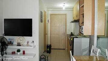 Fridge, microwave, coffee/tea maker, cookware/dishes/utensils