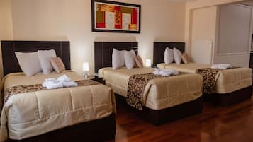 Standard Quadruple Room, Multiple Beds | Premium bedding, minibar, desk, laptop workspace