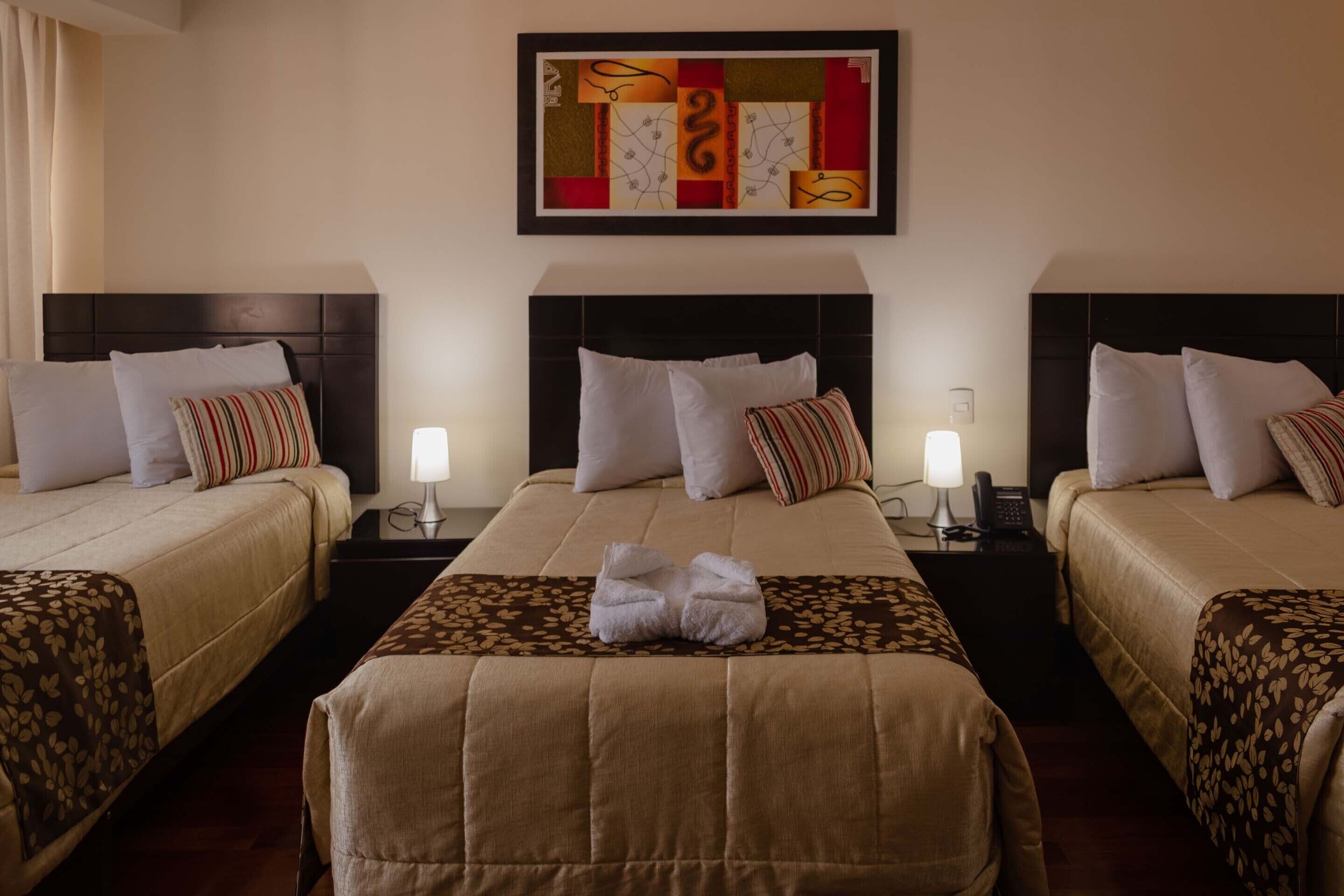 standard quadruple room, multiple beds | premium bedding, minibar, desk, laptop workspace