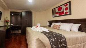 Standard Room, 1 King Bed | Premium bedding, minibar, desk, laptop workspace - Group House Apart Hotel (Cusco)