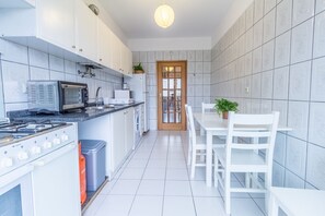 Fridge, microwave, oven, cookware/dishes/utensils
