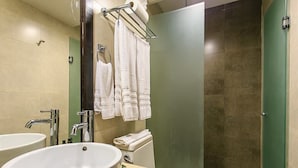A bathroom with a large sink, two faucets, a toilet, and a shower area. - Aldea Thai 12 by Tripintravel (Playa del Carmen)