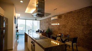 Condo | Private kitchen | Coffee/tea maker, full-sized fridge, microwave, oven - DOCA 301 by Tripintravel (Playa del Carmen)