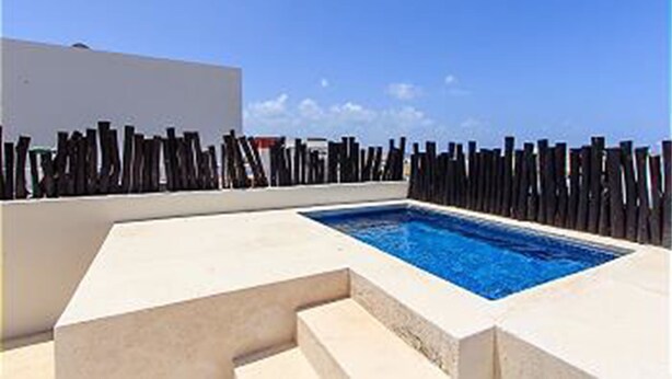 A rooftop pool with a clear blue sky in the background. - Nolita 31 by Tripintravel (Playa del Carmen)