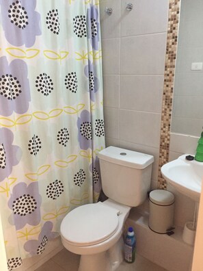 Apartment, 3 Bedrooms, 2 Bathrooms | Bathroom | Combined shower/tub, deep soaking tub, free toiletries, towels