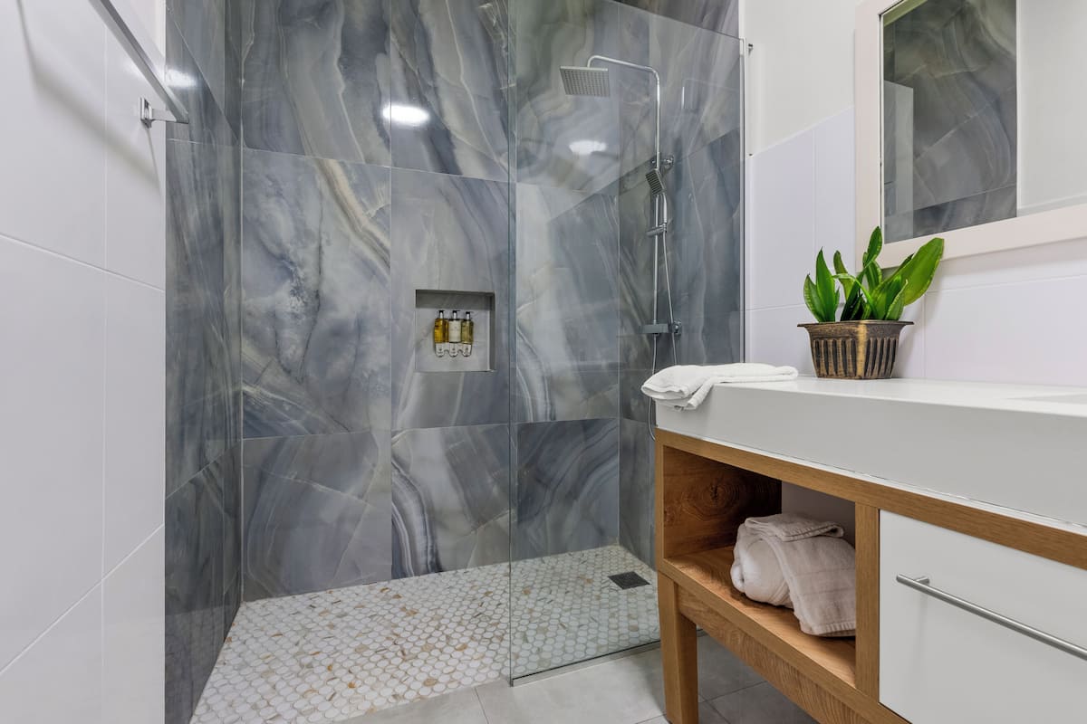 Shower, rainfall showerhead, towels, soap
