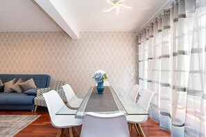 Family Apartment, 3 Bedrooms, Patio | Living room | 55-inch flat-screen TV with cable channels, TV - Pereira Place - The Dream (São Vicente)
