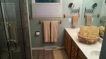 Shower, hair dryer, towels, soap