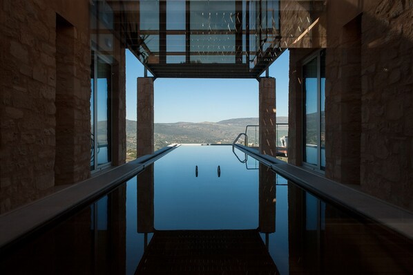 A heated pool, sun loungers