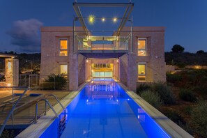 A heated pool, sun loungers
