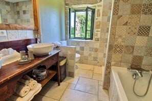 Bathtub, hair dryer, towels, soap