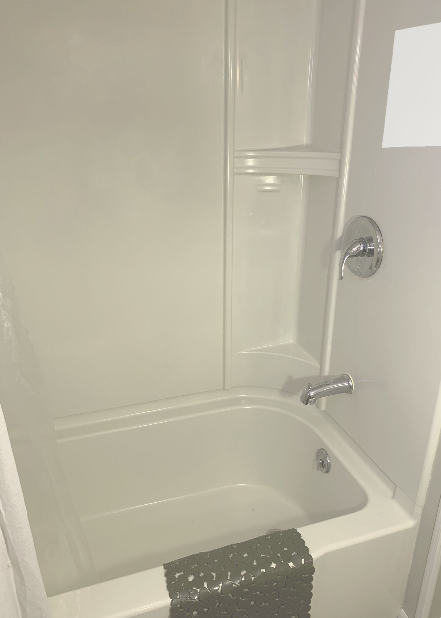 A bathroom with a bathtub, a shower, and a toilet.