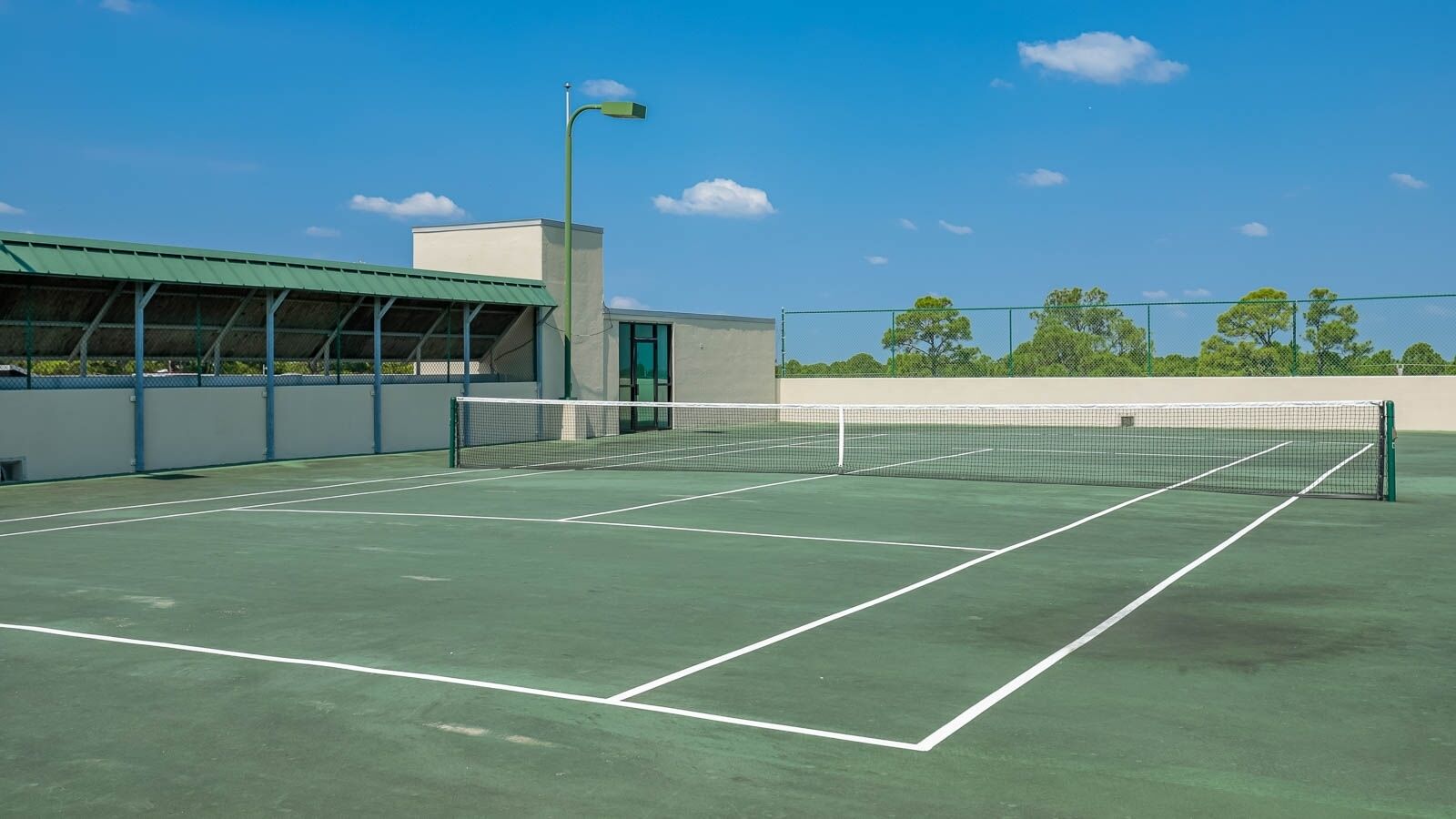 Play a match on the tennis court at Phoenix on the Bay with stunning views and plenty of space for your best game