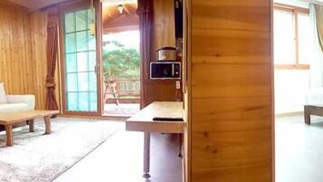 Family Double Room | Living room | 42-inch flat-screen TV with cable channels, TV