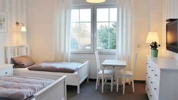 Condo família, banheira | Edredons de pluma, espaço de trabalho para notebook, Wi-Fi de cortesia