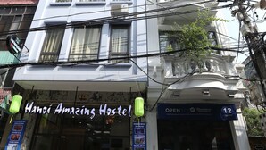 A building with a sign reading "Hanoi Amazing Hostel" and a number "12" indicating the room number. - Hanoi Amazing Hostel (Hanoi)