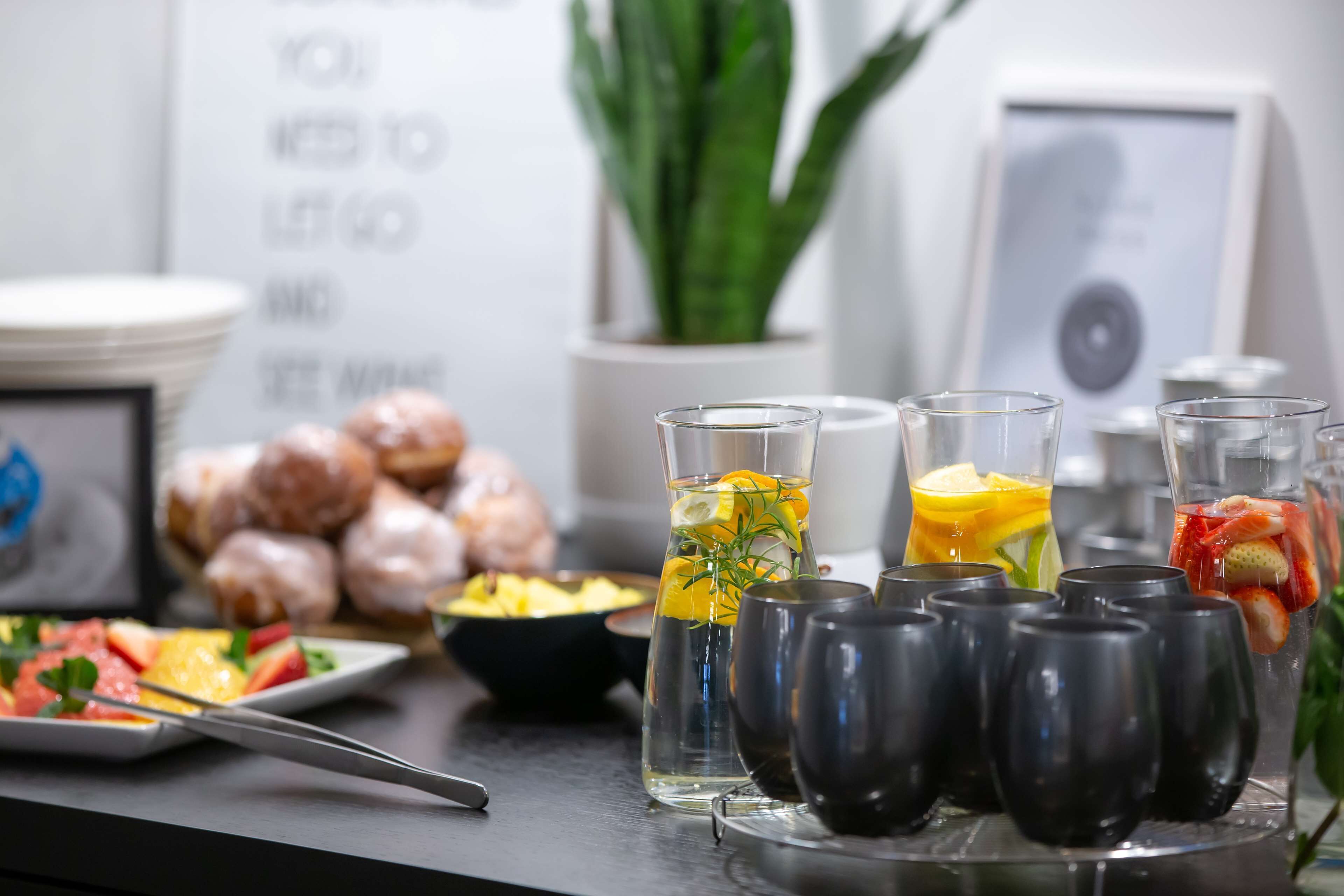 A breakfast buffet with various food items and beverages.