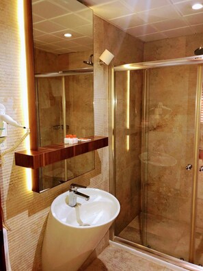 Shower, free toiletries, hair dryer, slippers
