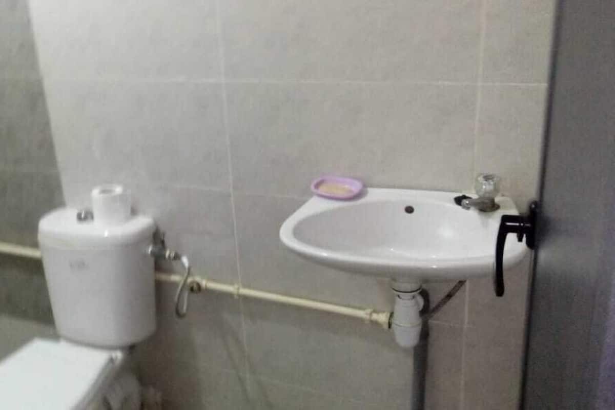 Habitación familiar | Baño | Regadera y toallas