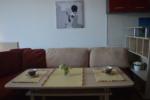 Comfort Apartment, 1 Bedroom, Balcony, City View | Living area | Flat-screen TV