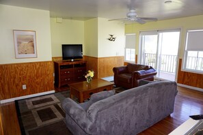 Apartment 1: 2 Bedroom, 1 Bath, Sleeps 6 | Living room | Flat-screen TV