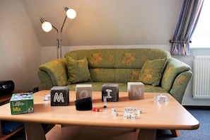 Apartment (Oland OG.) | Living room | Flat-screen TV - Haus Godewind (Dagebuell)