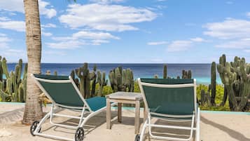 On the beach, sun-loungers, beach towels