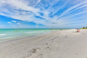 On the beach, sun loungers, beach towels