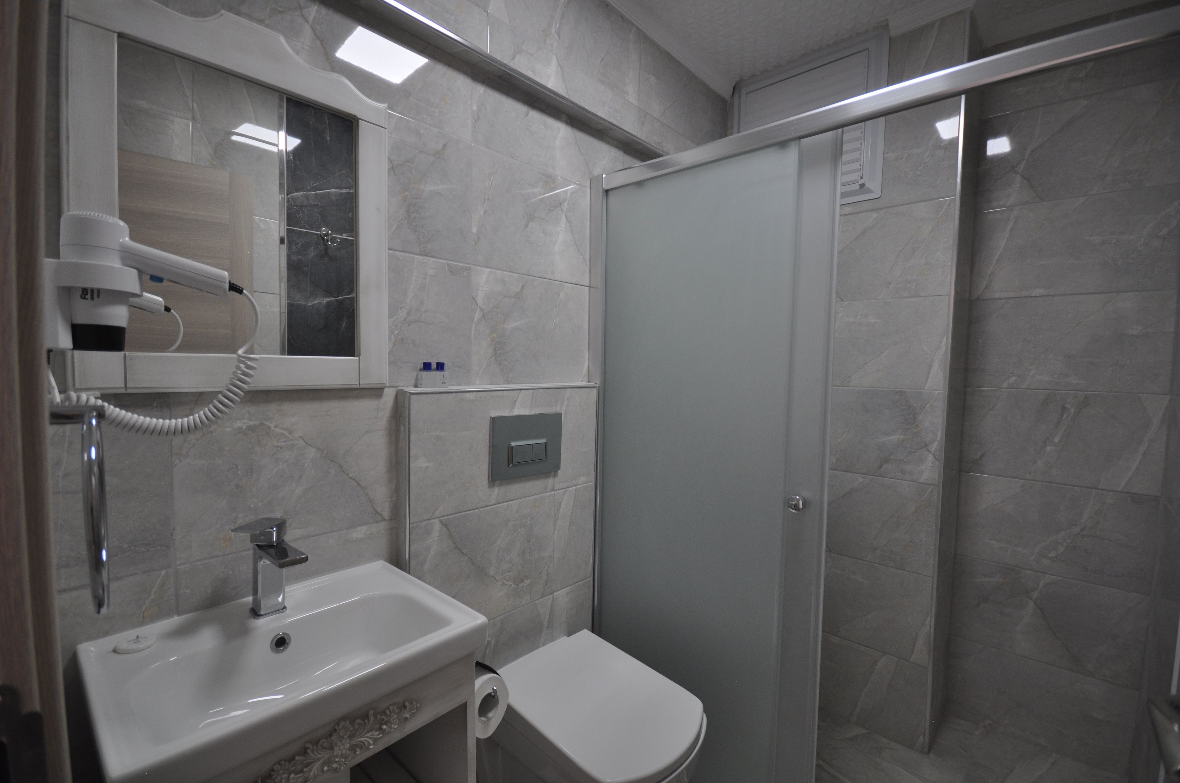 shower, free toiletries, hair dryer, slippers