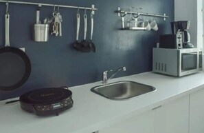 Fridge, microwave, stovetop, coffee/tea maker