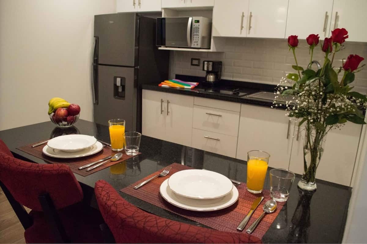 premium room, 1 king bed, non smoking | private kitchen | full-sized fridge, microwave, stovetop, coffee/tea maker