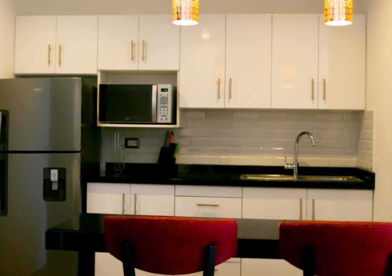 full-sized fridge, microwave, stovetop, coffee/tea maker