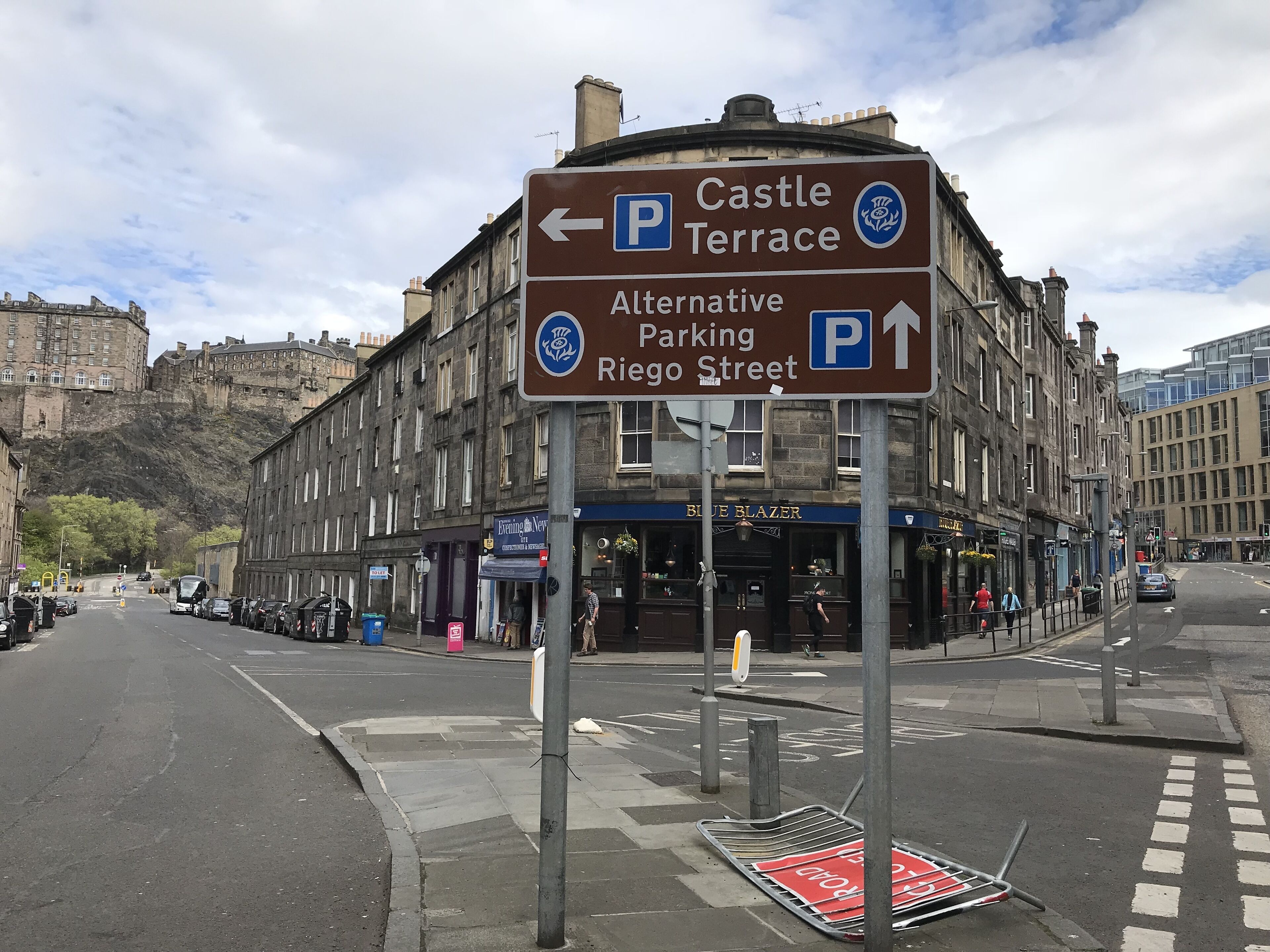 A street sign with directions to Castle Terrace and alternative parking on Riojo Street.