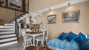 A modern living room with a staircase, dining area, and kitchen. - Stunning private villa with hot tub, private pool, A/C, WIFI, TV, terrace and pets allowed (Loborika)