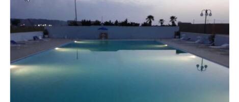 Seasonal outdoor pool, open 9:30 AM to 7:30 PM, free pool cabanas