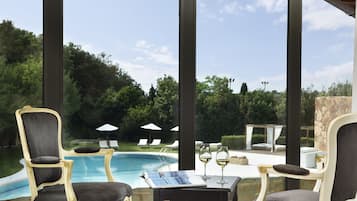 Junior Suite, 1 King Bed, Hot Tub, Pool View | 1 bedroom, down comforters, minibar, in-room safe