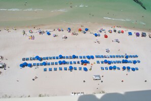 On the beach, sun-loungers