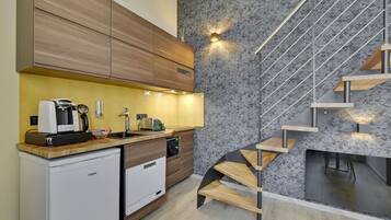 A modern kitchen with wooden cabinets, a built-in dishwasher, and a compact countertop.