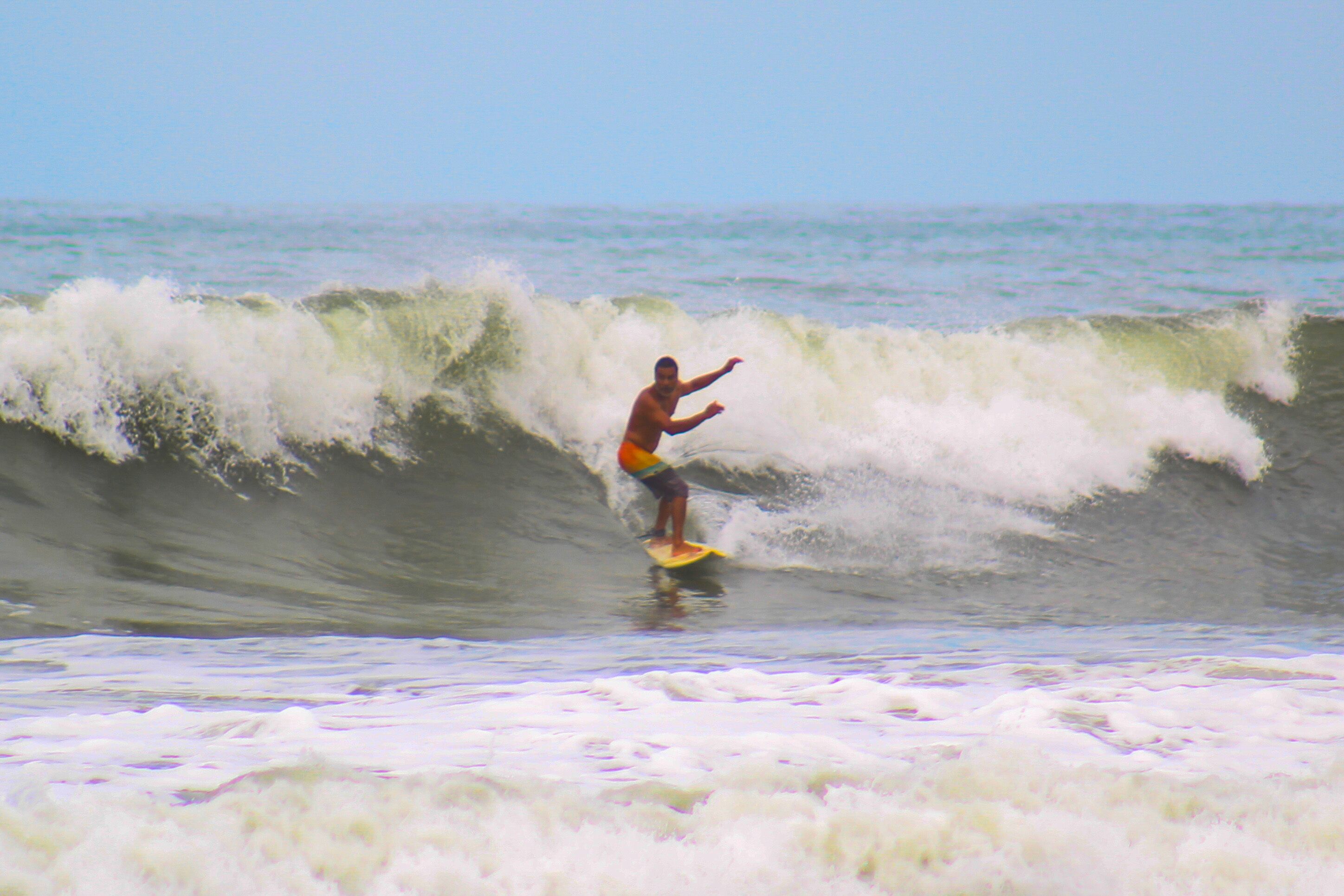 A person surfing on a wave.