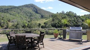 Outdoor fixed deck with BBQ overlooking the river