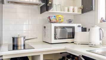 Fridge, microwave, stovetop, coffee/tea maker