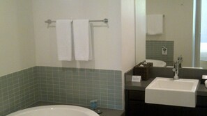 Bathtub, jetted tub, hair dryer, towels