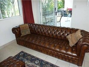 Flat-screen TV, DVD player, books, video library