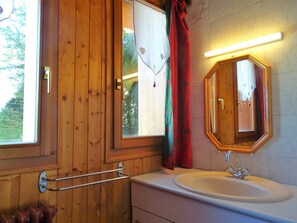 Bathtub, hair dryer, towels, soap