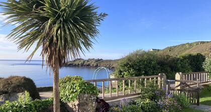 Superb sea views, private off-road parking, fenced garden; spacious, light, airy