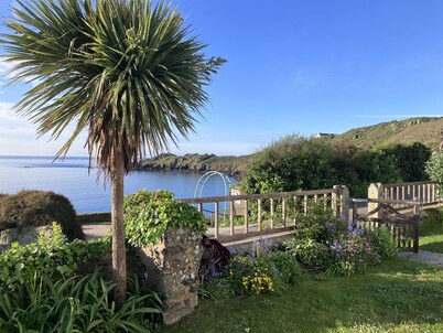Superb sea views, private off-road parking, fenced garden; spacious, light, airy