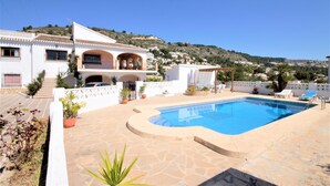 A Mediterranean-style villa with a swimming pool, terracotta tiled roof, and a hillside view. - Calas - Javea, Costa Blanca (Javea)